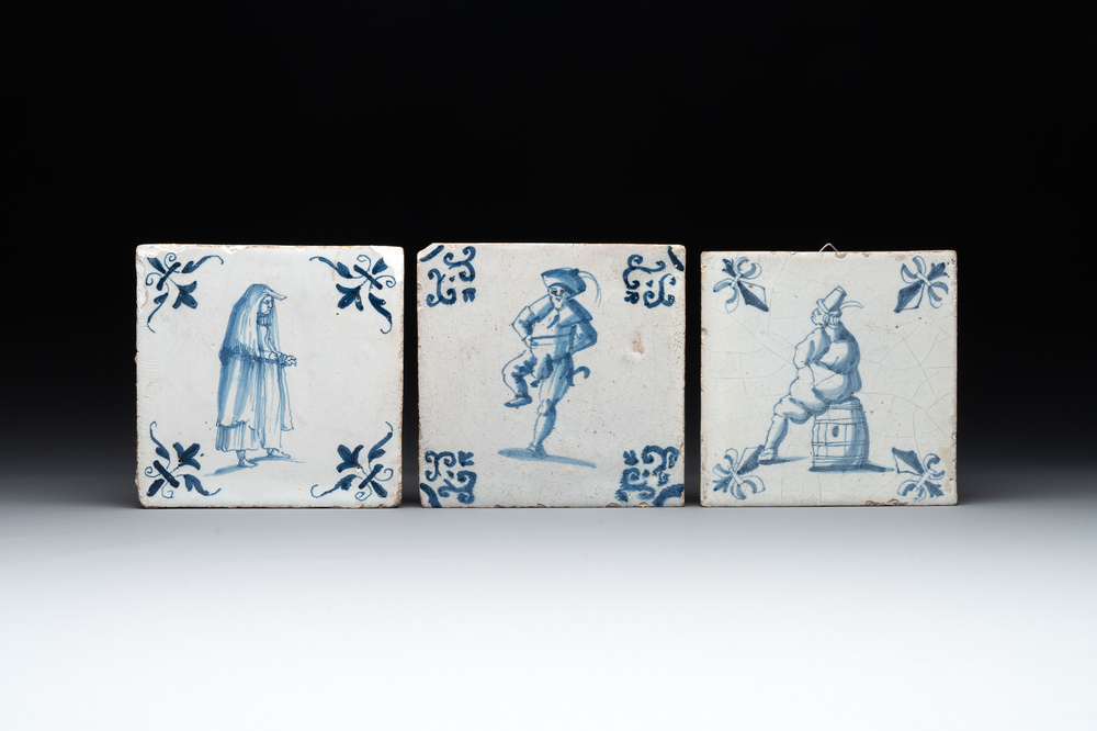 Three blue and white Dutch Delft tiles with large figures, 17th C.
