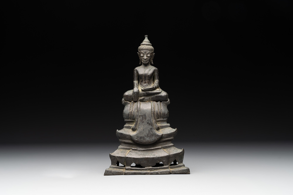A Laotian bronze figure of a seated Buddha, 19th C.