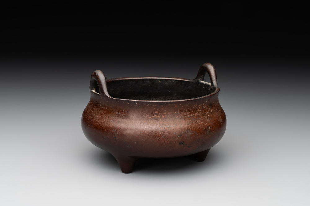 A Chinese bronze tripod censer, Xuande mark, Ming