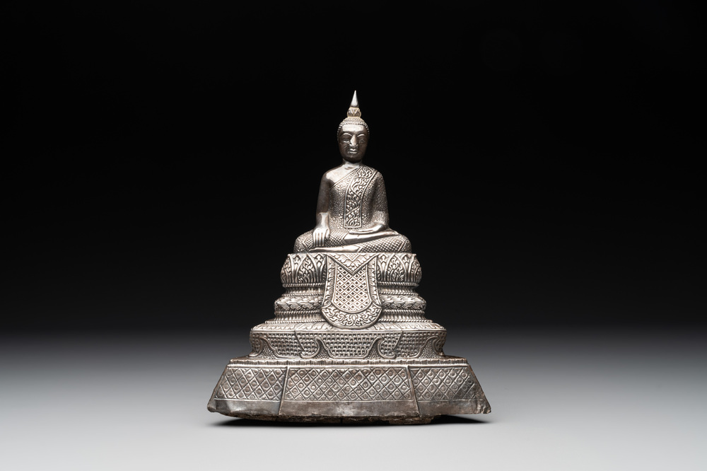 A Cambodian silver repouss&eacute; Buddha with inscription, 19th C.