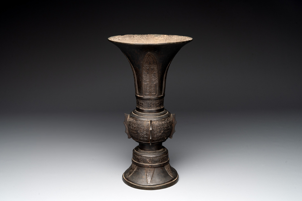 A Chinese archaistic bronze 'gu' vase with relief design, Ming