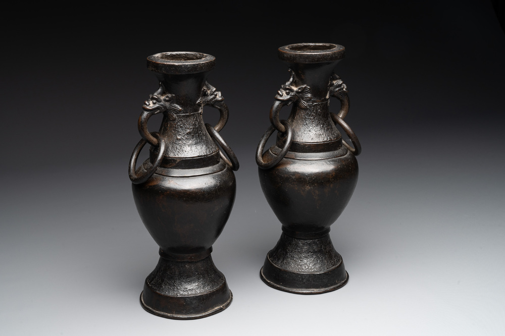 A pair of Chinese bronze vases with 'dragon' handles, Yuan/Ming