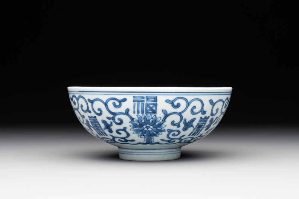 A Chinese blue and white 'fu and shou' bowl with flower scrolls, Yongzheng mark and of the period