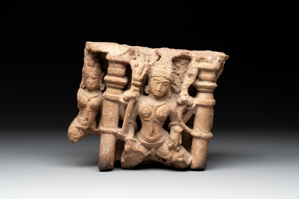 An Indian architectural red sandstone fragment with divinities, 13th C.