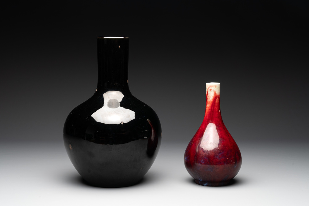 A Chinese black-glazed 'tianqiu ping' vase and a flamb&eacute;-glazed bottle vase, 19/20th C.