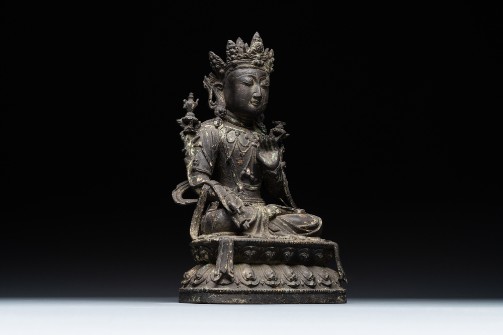 A Chinese bronze seated Bodhisattva on a lotus throne, Ming