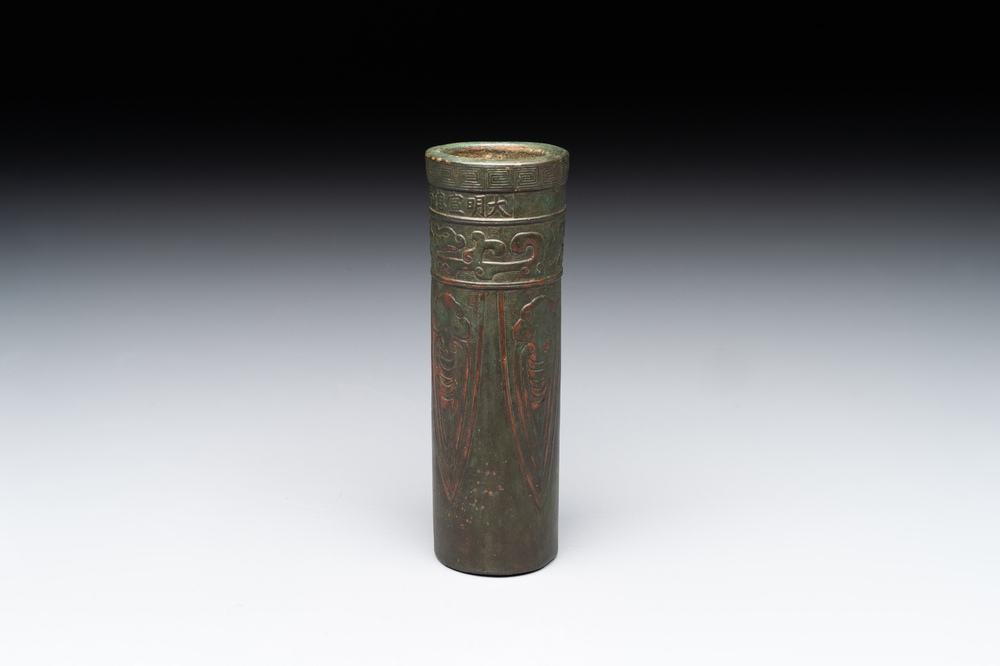 A Chinese bronze cylindrical 'cicada' flower arranging vase, Xuande mark, Ming