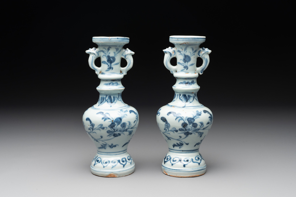A pair of Chinese blue and white handled vases with floral design, Ming