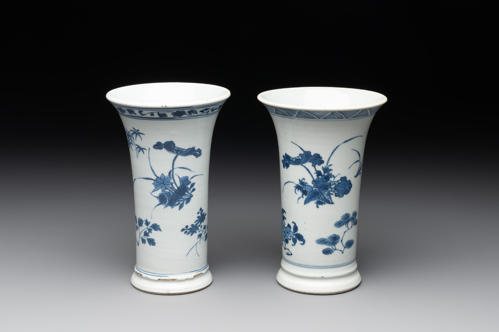A pair of Chinese blue and white beaker vases with floral sprigs, Transitional period