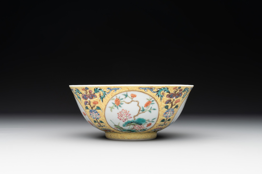 A Chinese blue, white and famille rose bowl with floral design, Qianlong mark, 19/20th C.