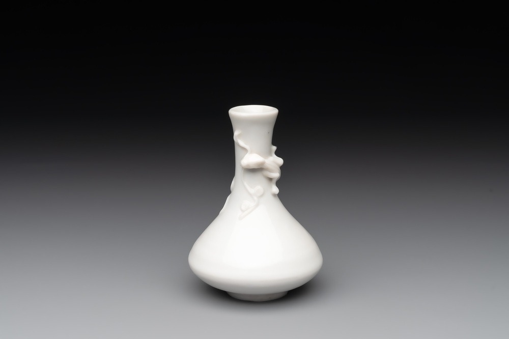 A small Chinese Dehua blanc de Chine 'dragon' bottle vase, Kangxi