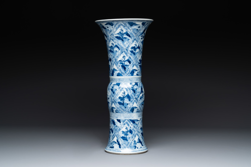 A Chinese blue and white 'landscape' 'gu' vase, Kangxi