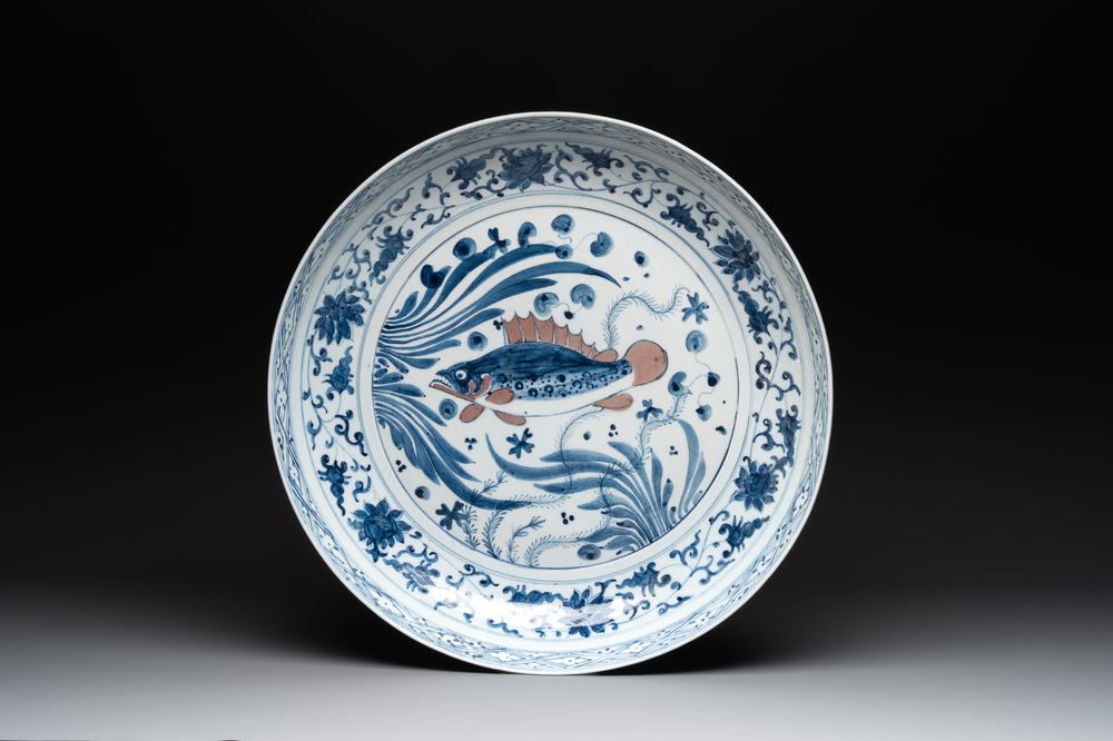 A large Chinese blue, white and copper-red 'carp' dish, 19/20th C.