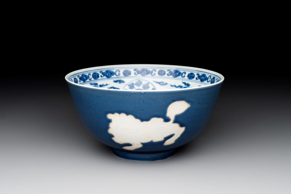 A Chinese powder blue-ground biscuit, blue and white 'Buddhist lion' bowl, Xuande mark, Kangxi