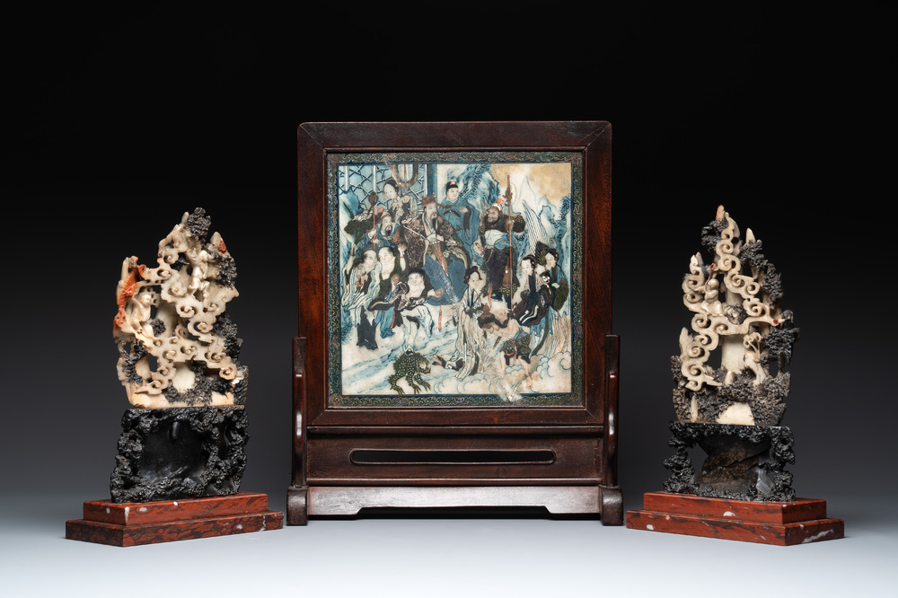 A pair of Chinese carved soapstone groups and a painted alabaster and wood table screen depicting a folk tale, 18/19th C.