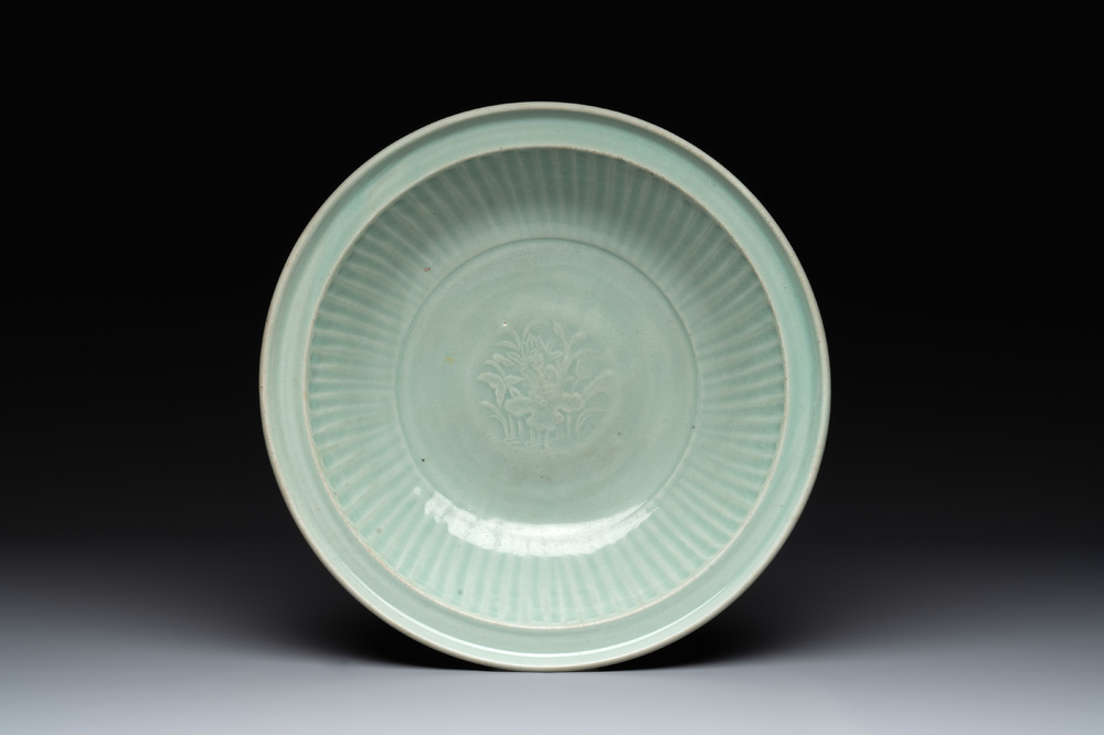 A Chinese Longquan celadon 'lotus' dish, Ming