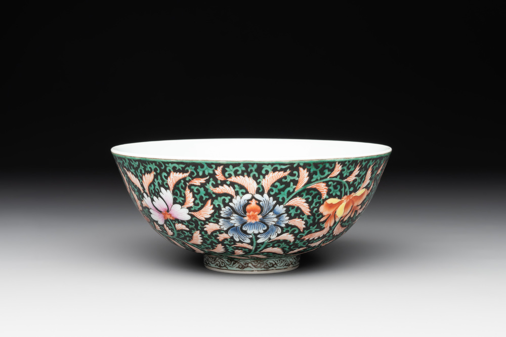 A Chinese black-ground famille rose 'flower scroll' bowl, Qianlong mark and of the period