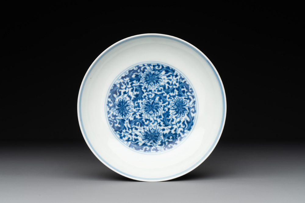 A Chinese blue and white 'flower scroll' plate, Yongzheng mark and of the period