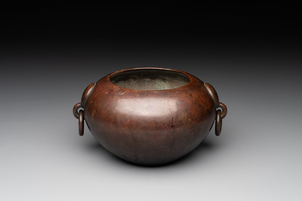 A Chinese bronze water pot with 'Taotie' handles, Xuande mark, 17/18th C.