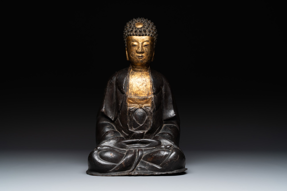 A large Chinese lacquered and gilt bronze Buddha, 17th C.