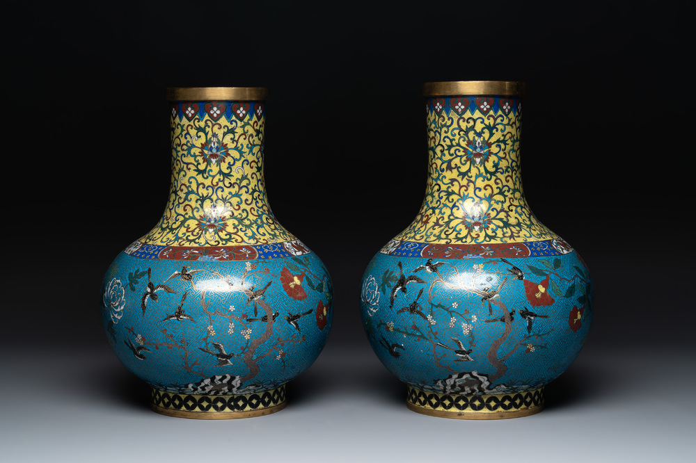 A pair of large Chinese cloisonn&eacute; 'magpies among flowering branches' vases, 19th C.