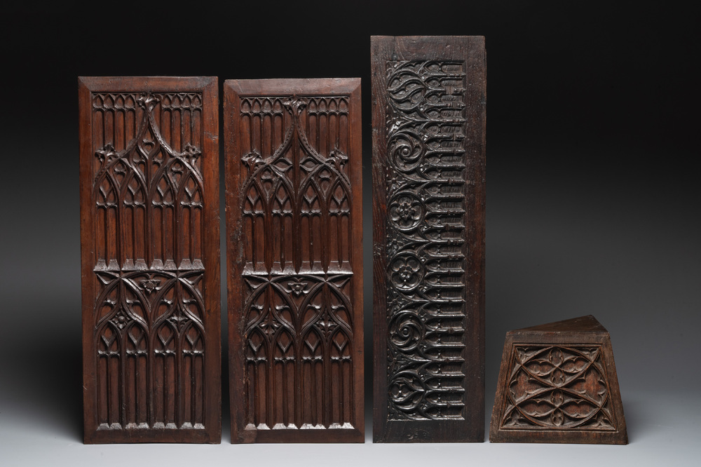 Three Gothic carved oak panels and a stand, France and Flanders, 15th C.