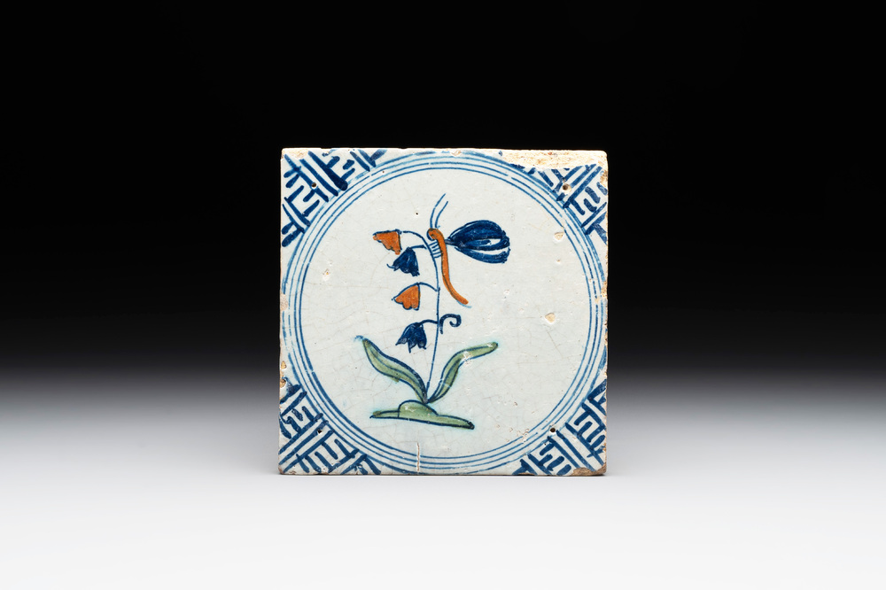 A polychrome Dutch Delft 'butterfly on a campanula' tile, 17th C.