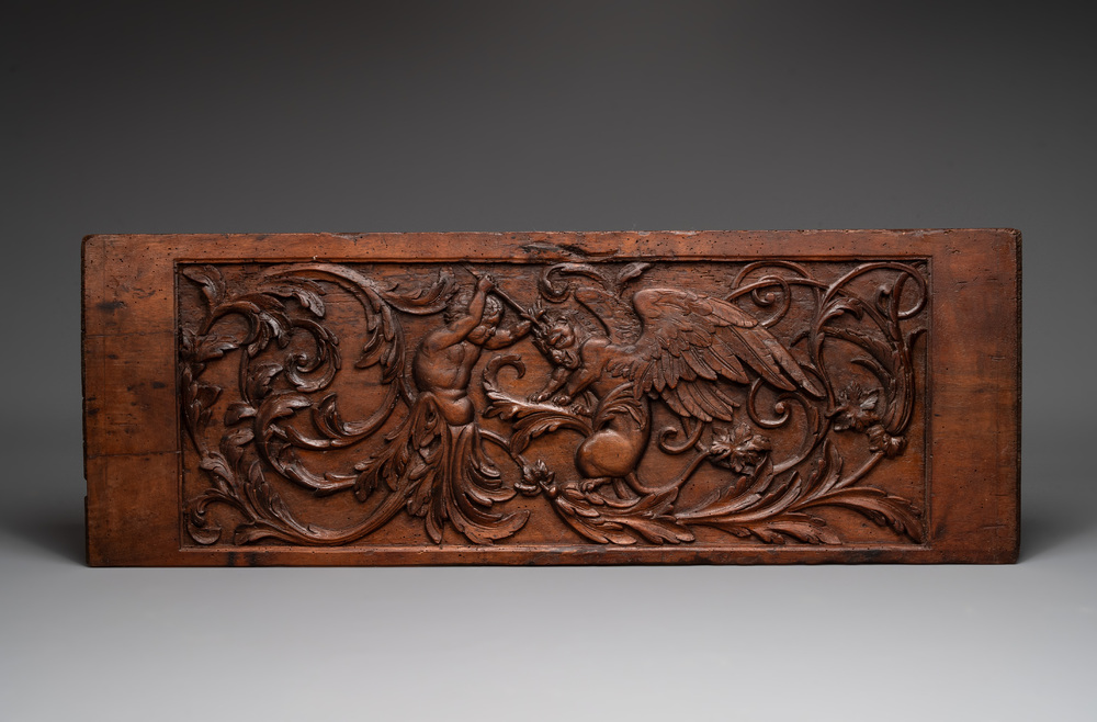 A carved walnut panel depicting the victory of good over evil, 16th C.