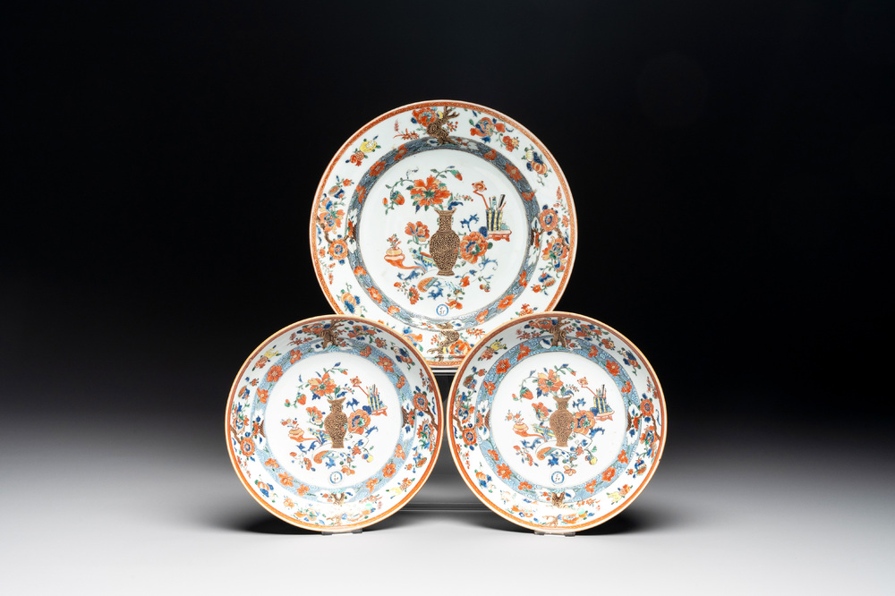 A Chinese famille rose 'antiquities' dish and two plates, Yongzheng/Qianlong