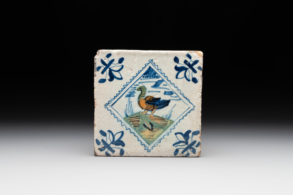 A polychrome Dutch Delft 'stamp' 'duck or goose' tile, late 16th C.