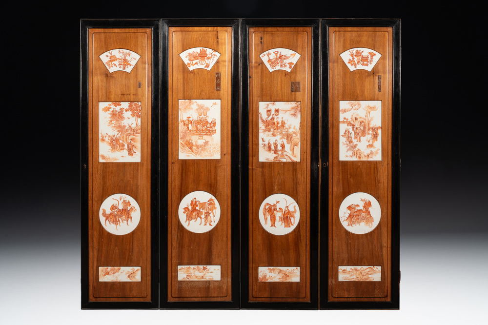 A Chinese four-part folding screen with iron-red-decorated porcelain plaques, 19/20th C.