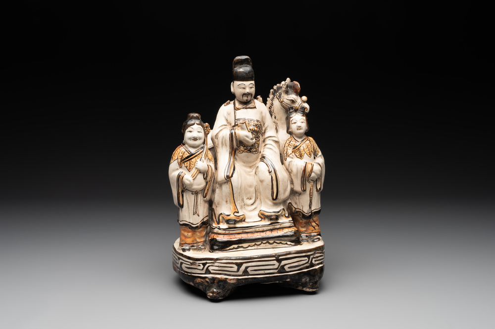 A rare Chinese Cizhou group with a dignitary, two attendants and a horse, Ming