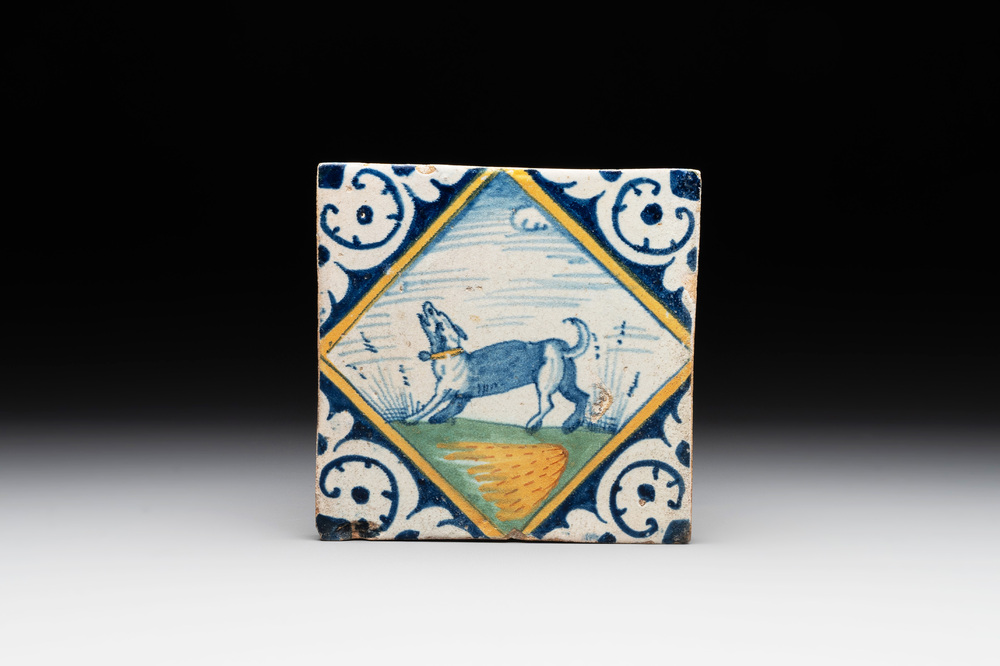 A polychrome Dutch Delft maiolica 'diamond' 'dog' tile, late 16th C.
