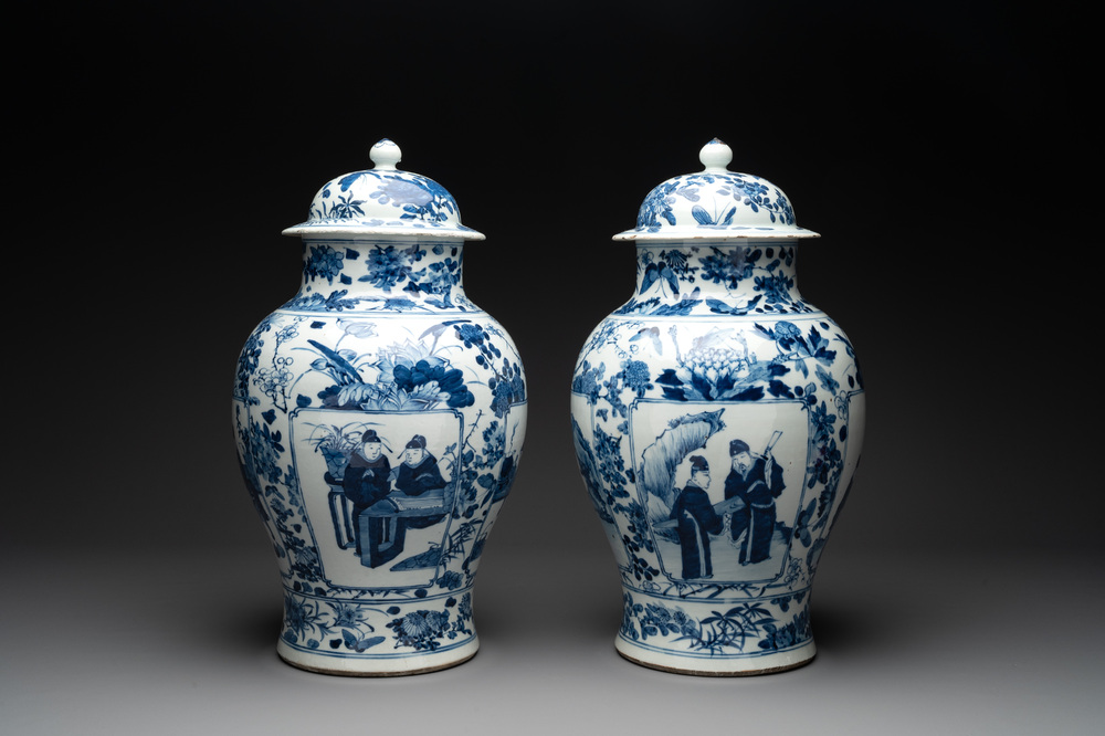 A pair of Chinese blue and white vases and covers with figural panels, 19th C.