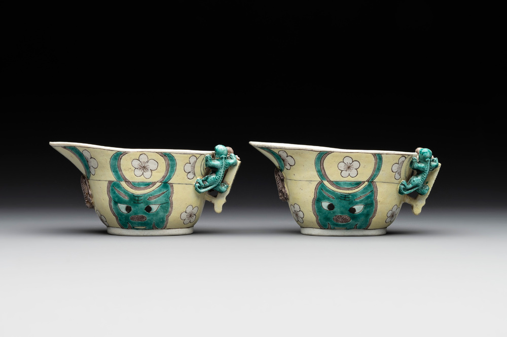 A pair of fine Chinese sancai-glazed 'Buddhist lion and chilong' libation cups, Kangxi