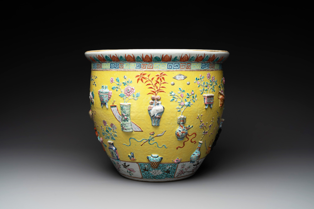 A Chinese famille rose yellow-ground relief-molded 'antiquities' fish bowl, Zhengde mark, 19th C.