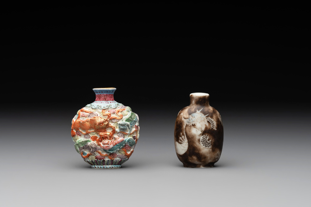 A Chinese famille rose molded 'Buddhist lions' and a grisaille 'dragon' snuff bottle, Qianlong and Daoguang mark, 19th C.