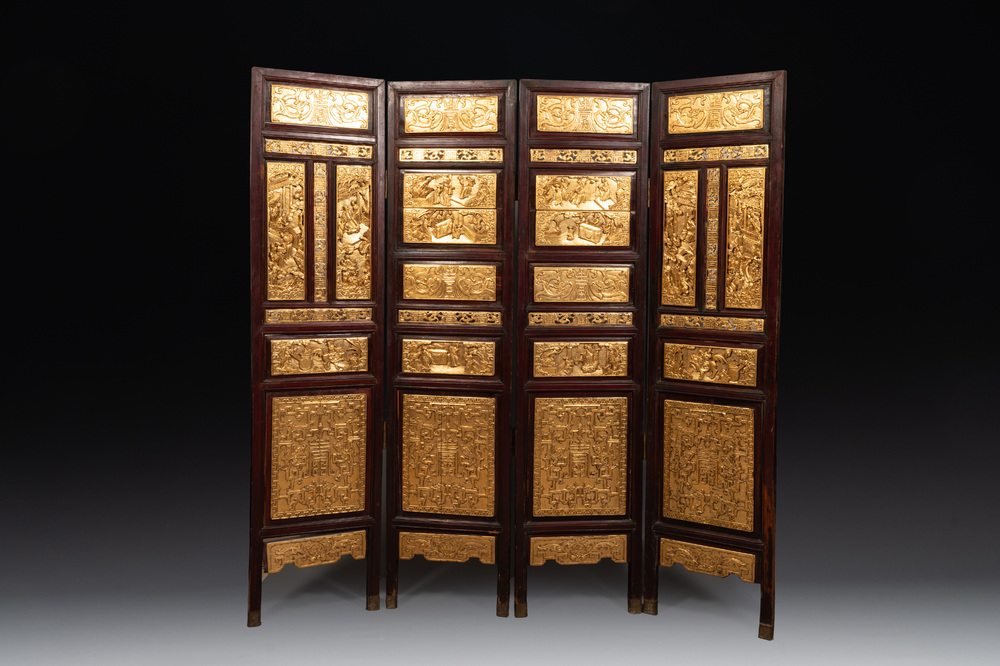 A Chinese four-part reticulated and partially gilt wooden folding screen, 19th C.