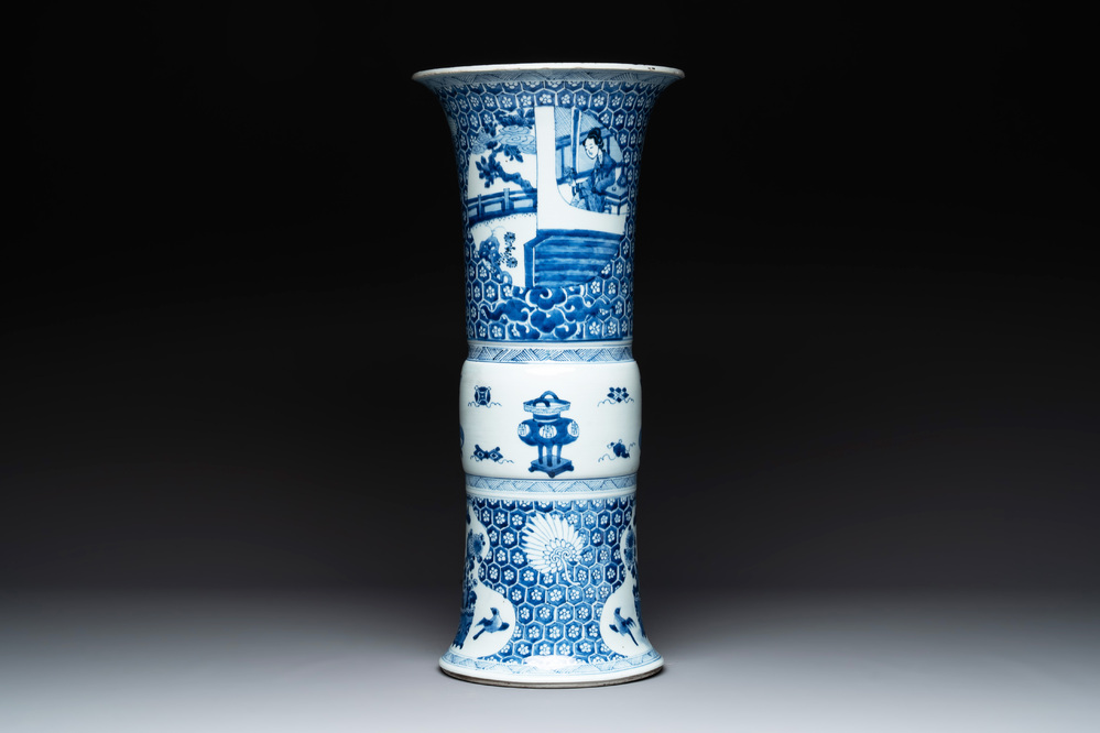 A Chinese blue and white 'gu' vase with a lady and antiquities, Kangxi