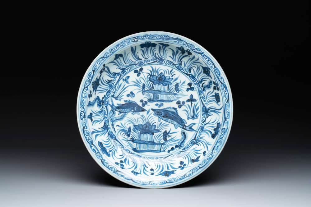 A rare Chinese blue and white 'fish swimming in a lotus pond' dish, Hongzhi/Zhengde