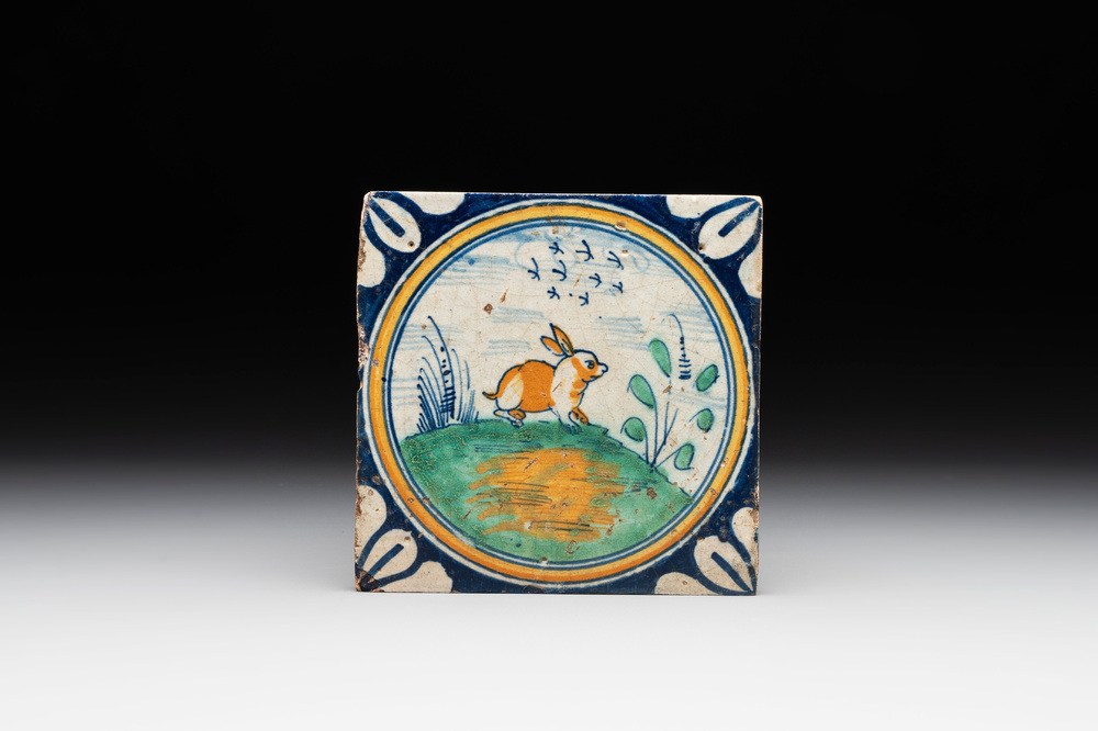 A polychrome Dutch Delft maiolica 'medallion' 'hare' tile, late 16th C.