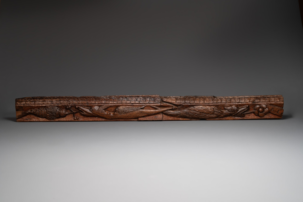 A large oak sculpted panel with two dragons and decorations, probably 13th C.