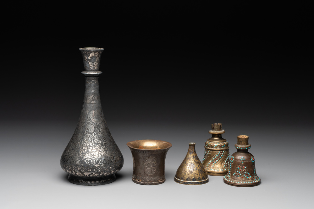 A bidriware vase, a steel hookah cup and three copper alloy hookah mounts, India/Persia, 19th C.