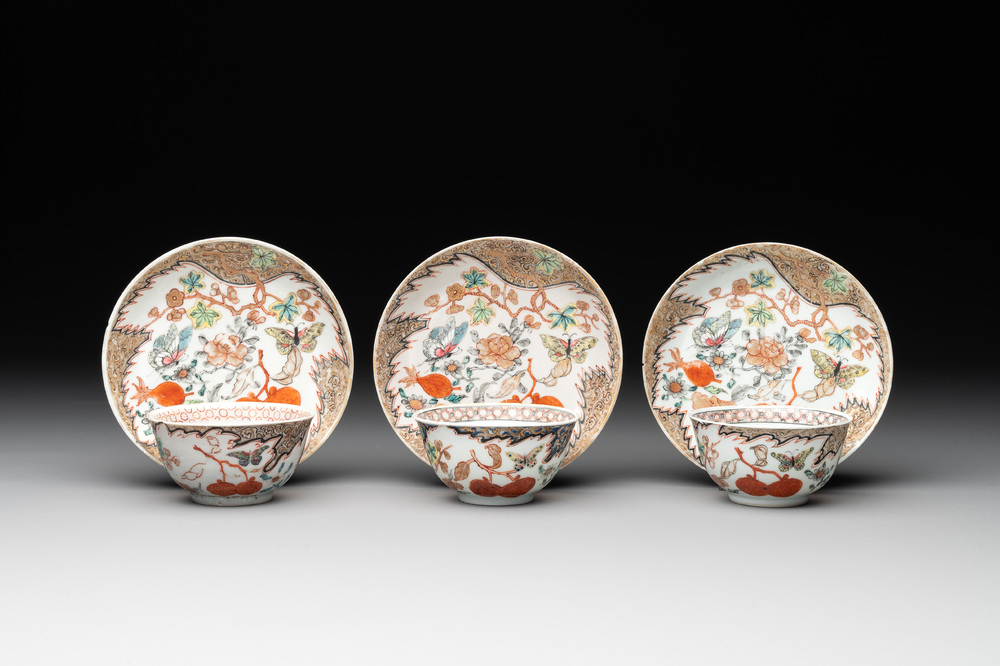 Three Chinese famille rose 'flowers and butterflies' cups and saucers, Yongzheng