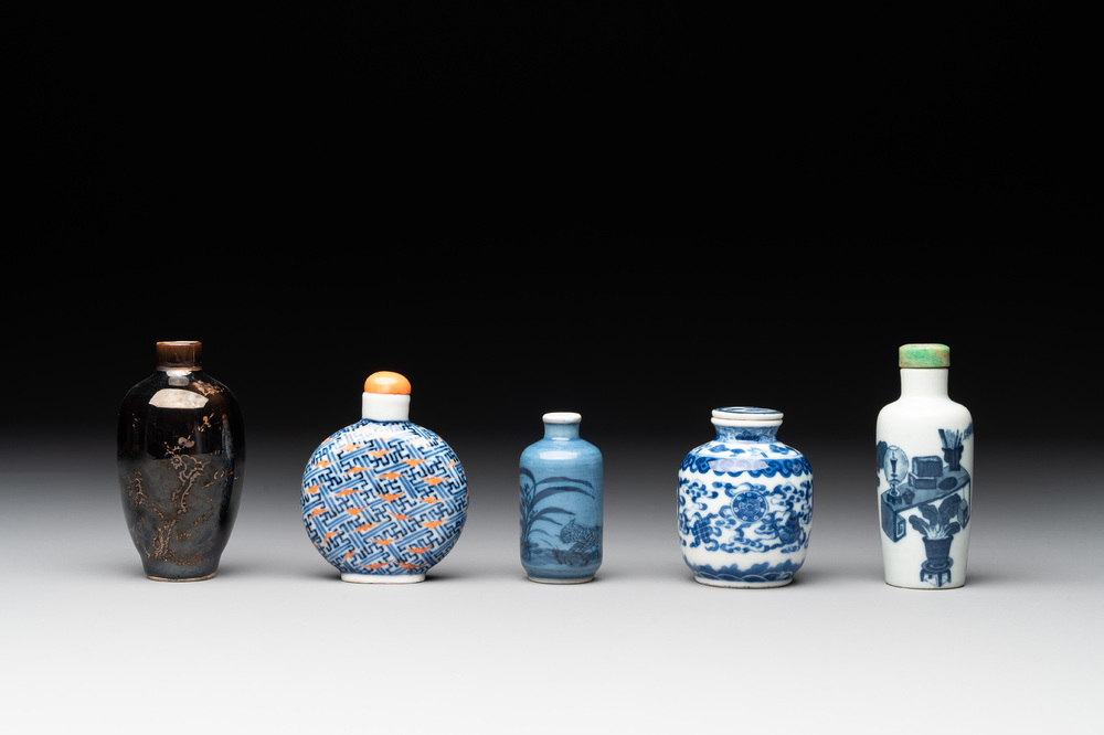 Five Chinese blue and white, iron-red and mirror-black-glazed snuff bottles, Qianlong mark, 19th C.