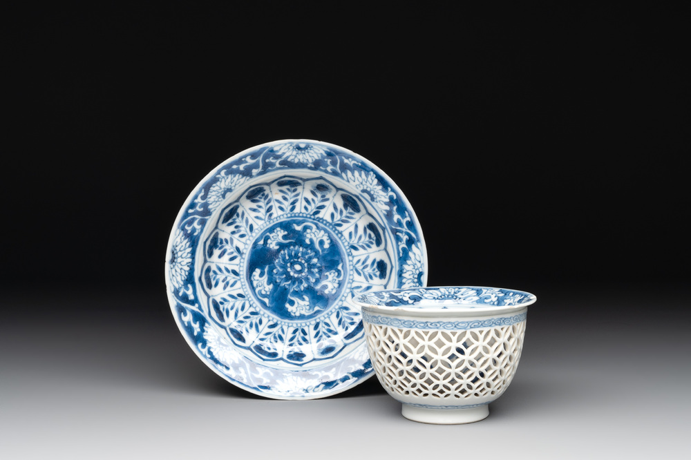 A Chinese blue and white reticulated double-walled cup and saucer, fu mark, Kangxi