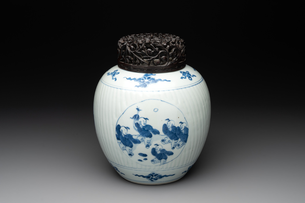 A Chinese blue and white 'playing boys' vase and wooden cover, Kangxi