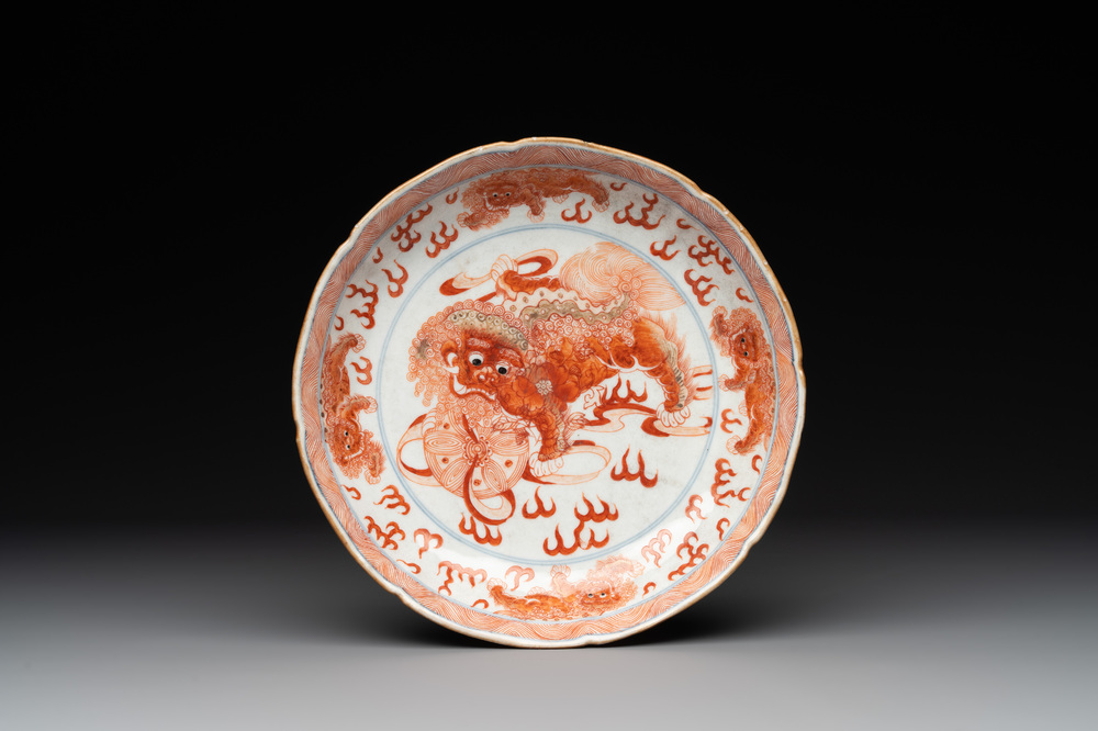 A Chinese blue, white and iron-red 'Buddhist lion' plate, Qianlong mark and of the period