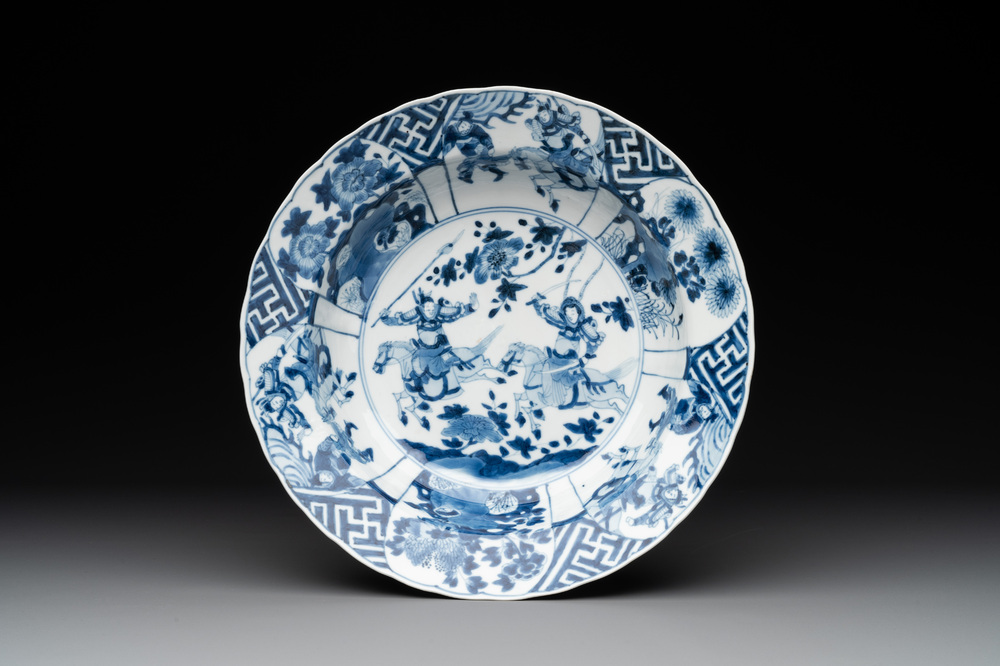 A Chinese blue and white 'warriors on horseback' 'klapmuts' bowl, Kangxi mark and of the period