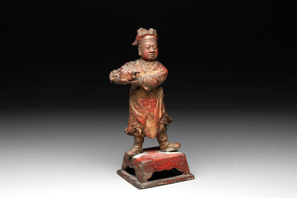 A Chinese gilt-lacquered bronze offering figure on stand, Ming